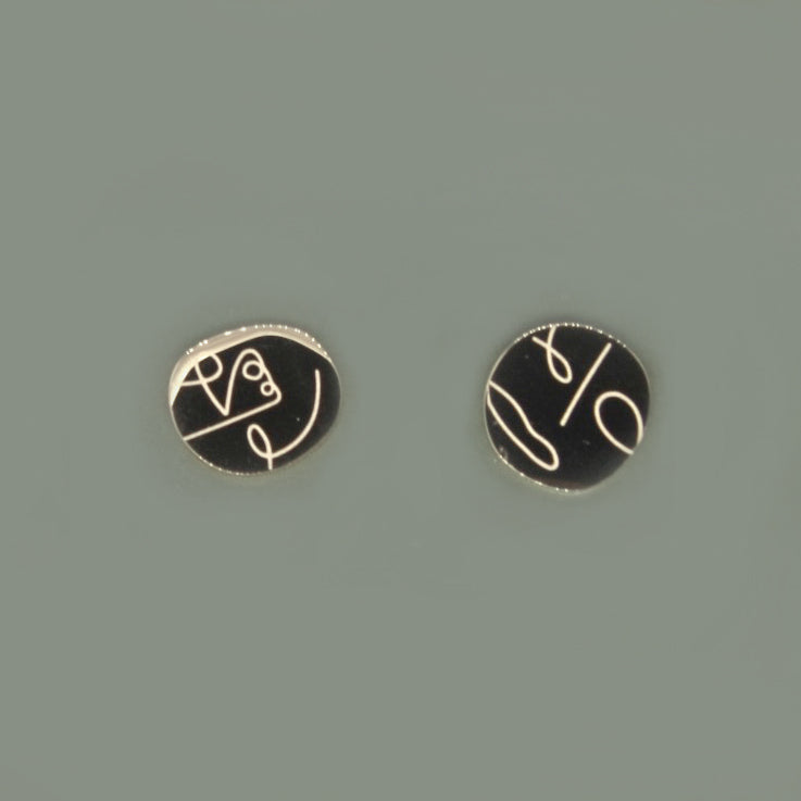 Abstract face stud earrings